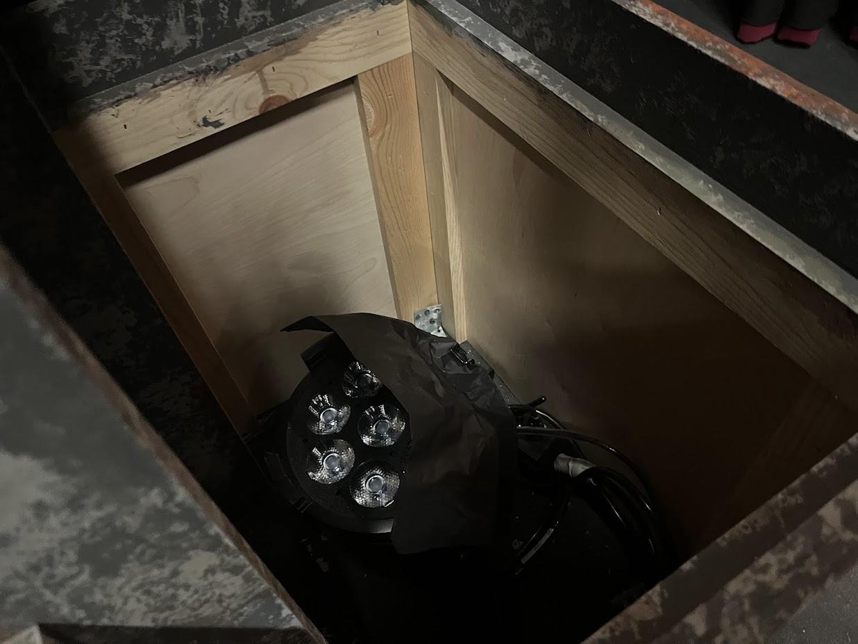 Pillar up lighting using blackwrap to keep light off the ceiling